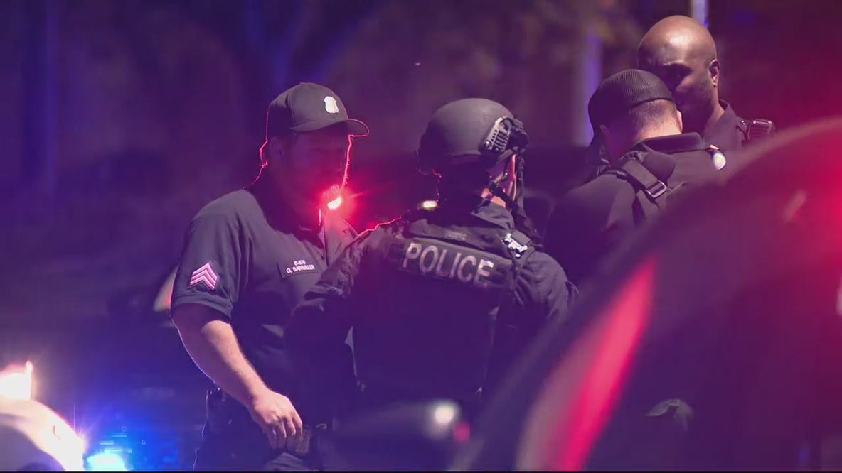 Barricaded gunman killed by police after pointing gun at officer